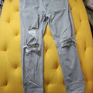 Pacsun grey skinny jeans with holes in front